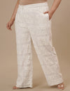 Plus-size woman in side angle view wearing White Lace Plus Size Co-Ord Set with delicate lace texture and relaxed silhouette