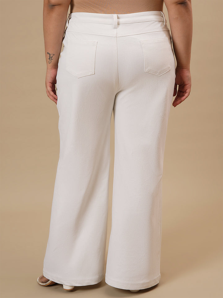 Plus-size woman in back view wearing White Plus Size Bootcut Jeans with classic pockets and bootcut fit