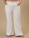 Plus-size woman in front view wearing White Plus Size Bootcut Jeans featuring bootcut silhouette and clean finish