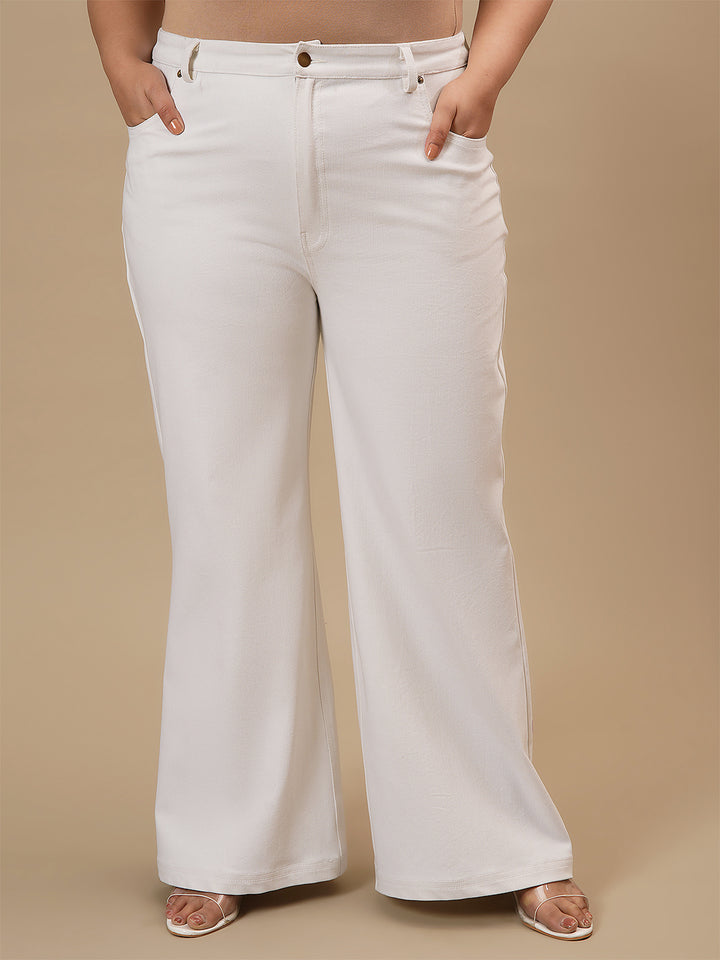 Plus-size woman in front view wearing White Plus Size Bootcut Jeans featuring bootcut silhouette and clean finish