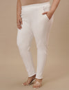 Plus-size woman in front left angle view wearing White Plus Size Jeggings with body-hugging fit and high waist