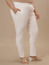 Plus-size woman in side angle view wearing White Plus Size Jeggings with fitted leg and clean silhouette