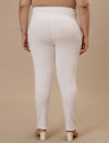 Plus-size woman in back view wearing White Plus Size Leggings With Pockets featuring contoured fit and smooth finish