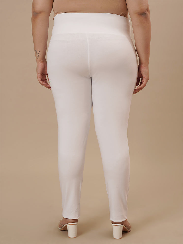 Plus-size woman in back view wearing White Plus Size Leggings With Pockets featuring contoured fit and smooth finish