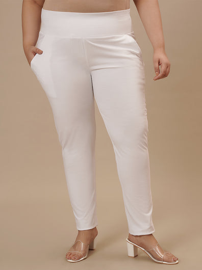 Plus-size woman in front view wearing White Plus Size Leggings With Pockets featuring sleek fit and supportive waistband
