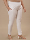 Plus-size woman in right side view wearing White Plus Size Leggings With Pockets with snug fit and side pocket detail