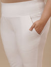 Close-up view of White Plus Size Leggings With Pockets showing high-rise waistband and soft stretch fabric