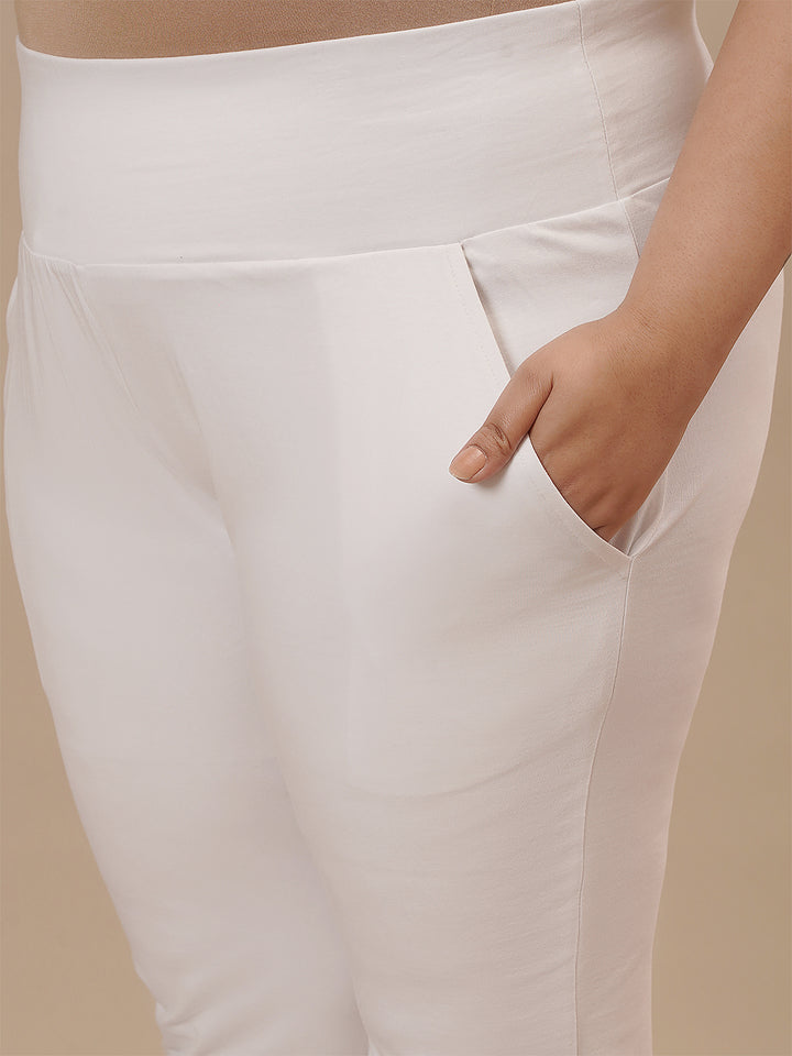 Close-up view of White Plus Size Leggings With Pockets showing high-rise waistband and soft stretch fabric