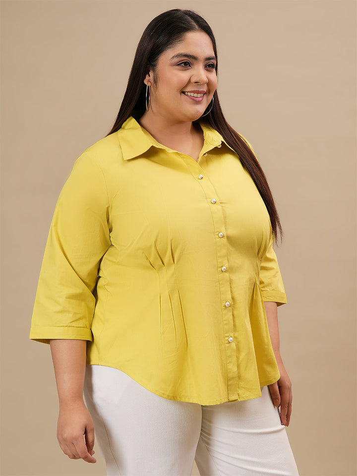 Plus-size woman in right side view wearing Yellow Plus Size Cotton Shirt with curved hem and breathable cotton texture