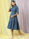 Side view of Wobbly Walk Denim Maternity Dress showcasing its relaxed fit over the baby bump
